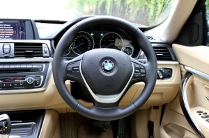 Steering wheel is perfect in size. Touch and feel is average, and does not get paddle shifts.