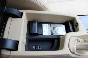 Storage cubicle below the sliding driver armrest. USB, Aux-in and iPhone adapter placed here.