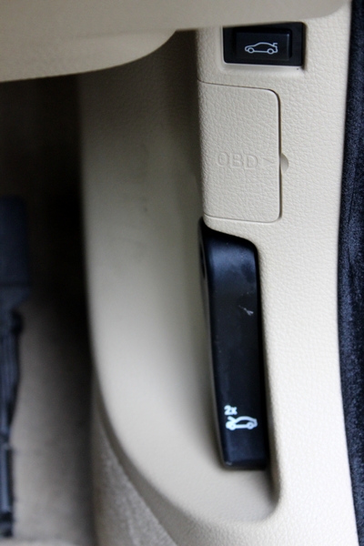 Pull the black lever twice to pop the bonnet open. Boot release button on top, and a spot for the OBD.