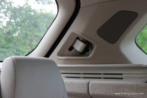 A speaker mounted on the D pillar and the third row seatbelt neatly tucked in