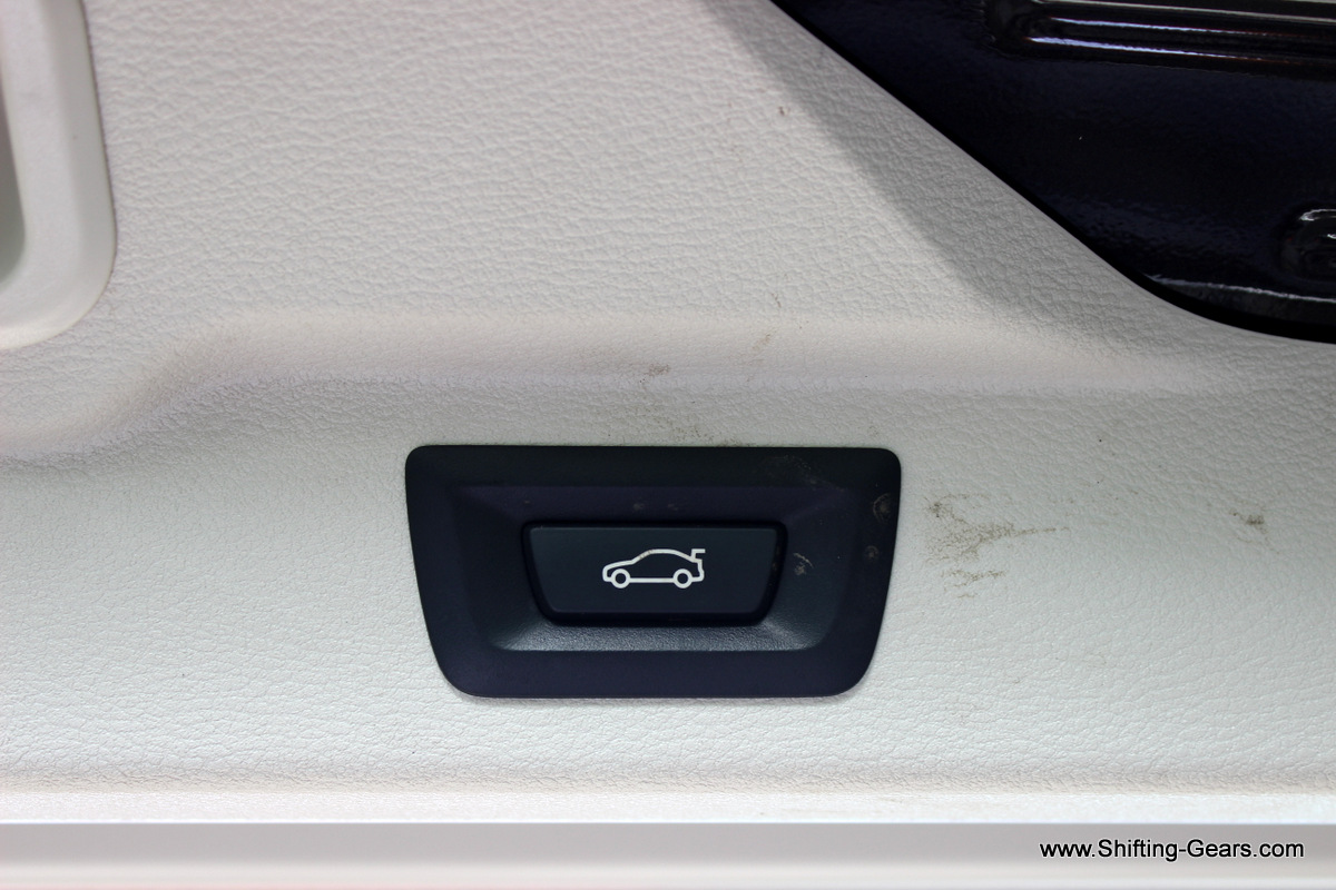 Lower section of the tail gate needs to be shut manually. For the top section, press this...