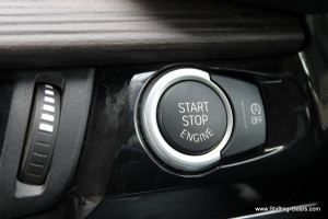 Start stop button and the Auto-Start stop control switch next to it