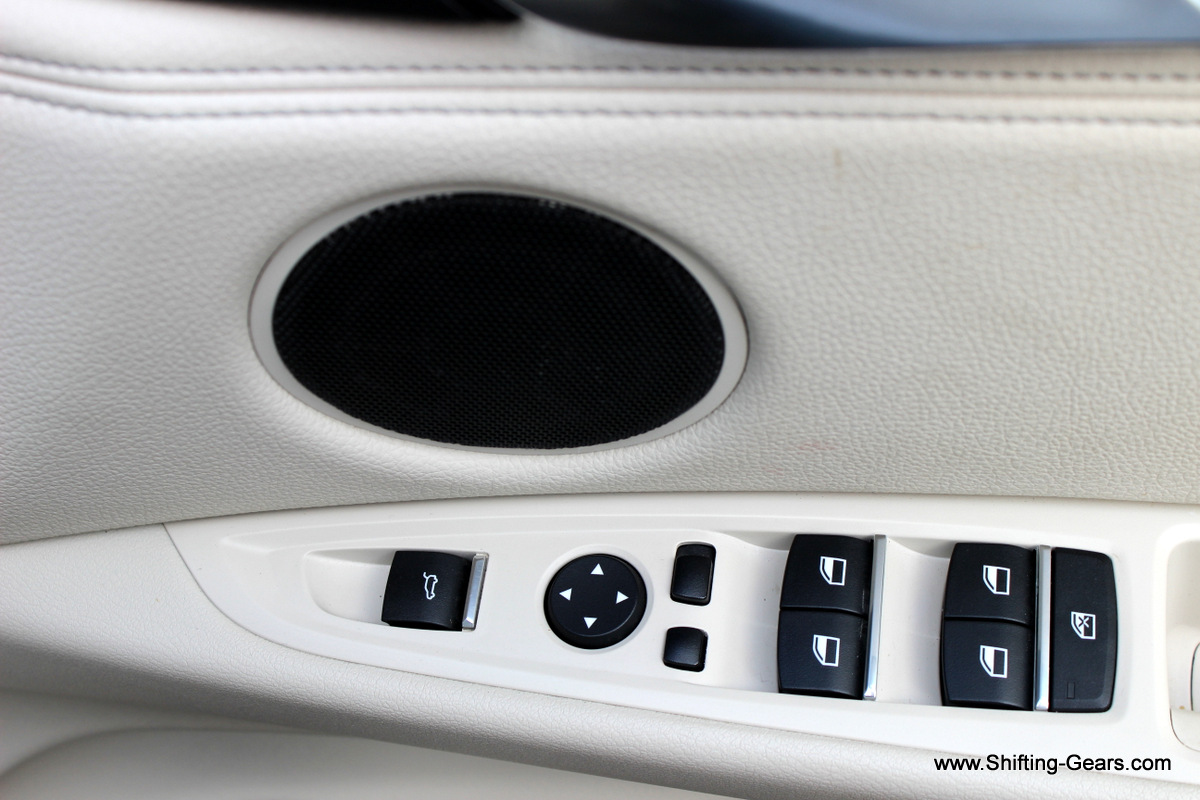 Controls on the driver door pad and a speaker above