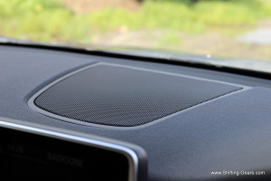 A speaker placed behind the infotainment screen