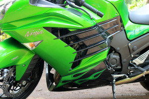 Thematic quadruple fins on the side fairings. On the 2014 model, they are seen in black, the 2013 version was green.