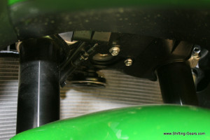 Horn mounted in front of the radiator