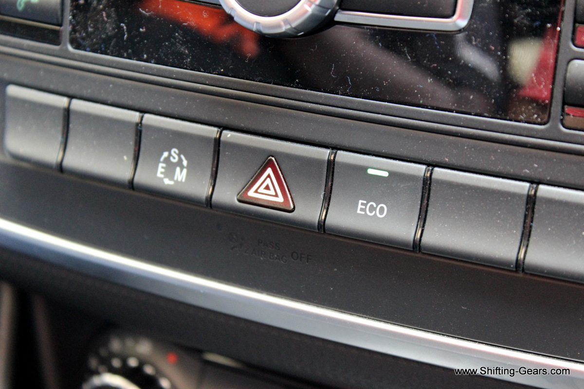 Below the stereo system, you have the buttons to select the ECO mode and switch to other driving modes