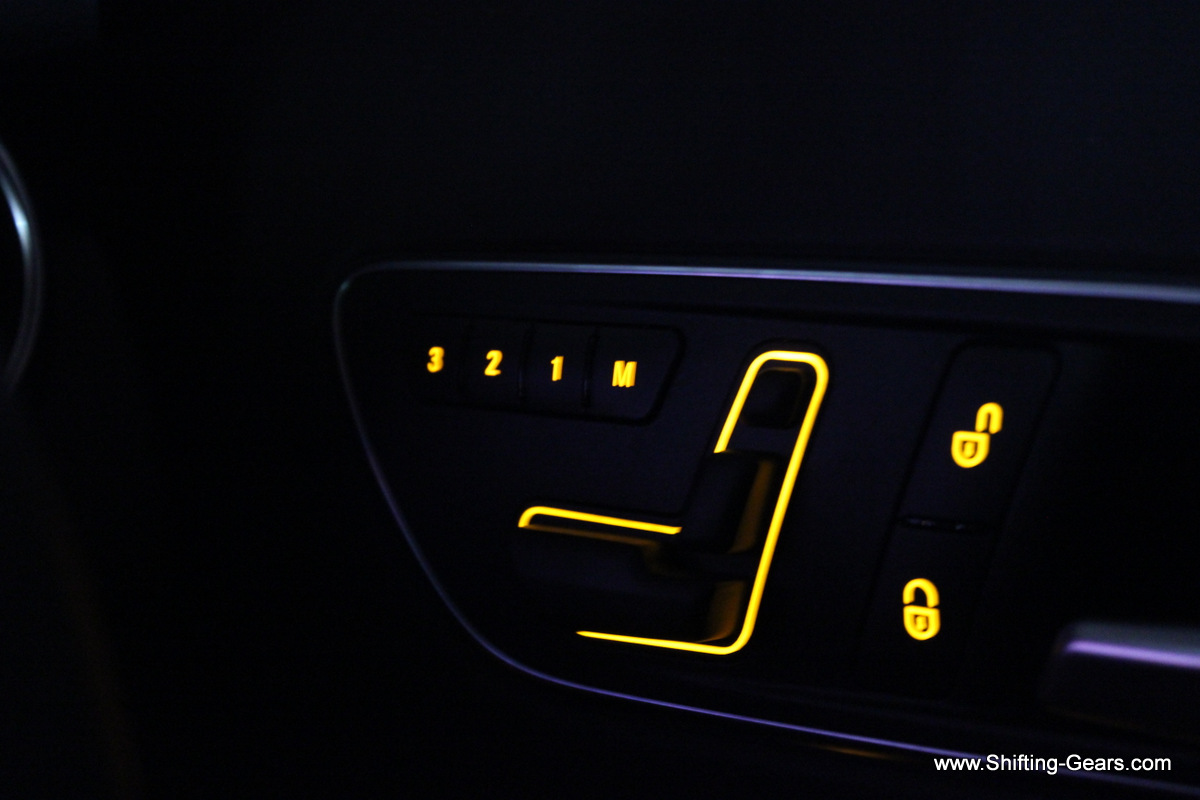 Electric seat adjustment buttons are neatly illuminated at night