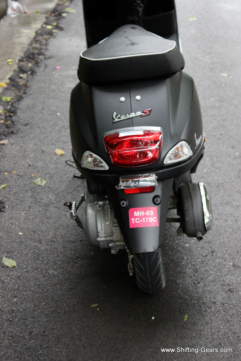 Rear end is identical, except for the missing pillion grab rail on the Vespa S. It gets two chrome rivets instead.