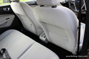 Legroom for the rear passengers is inadequate. Seat-back pockets on both the front seats.
