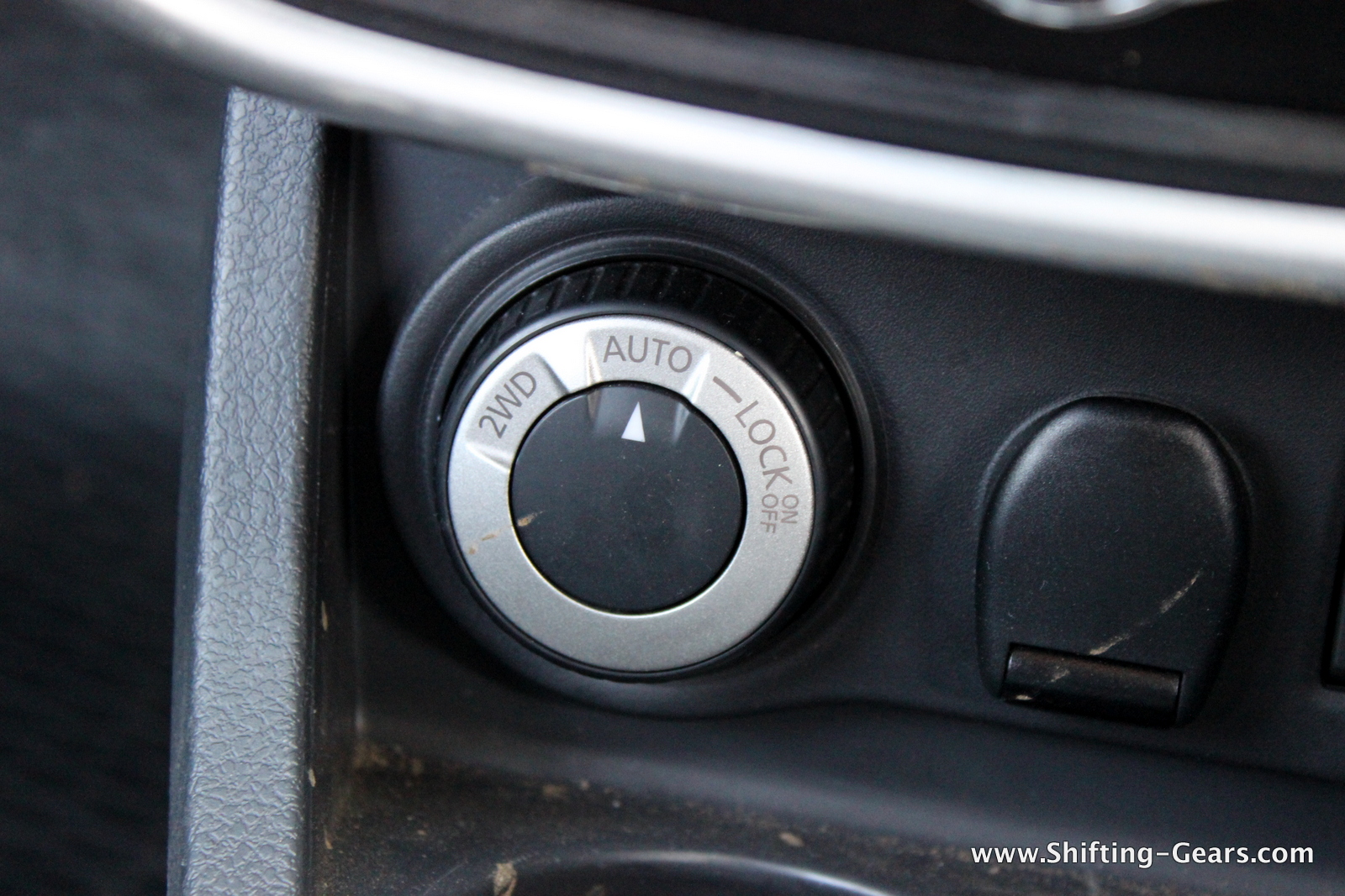 Shift-on-fly lever is placed under the AC controls