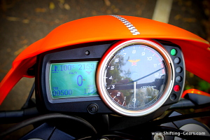 Analogue + digital instrument cluster lacks premium appeal, surely not the right quality for a bike costing upwards of Rs. 30 lakh