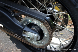 Close look at the chain cover, chain sprocket and chain adjustment lever