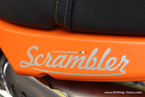 The Scrambler decal with a small Italian flag under the pillion seat