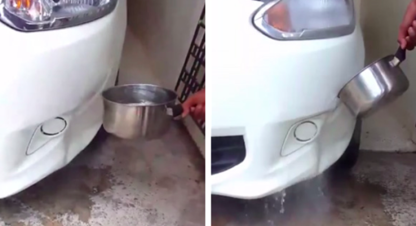 Guy removes car dent with boiling water